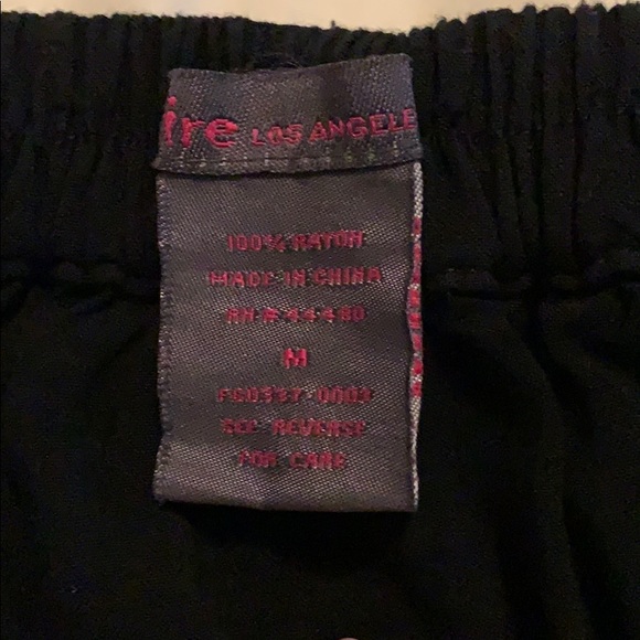 Black flowing high waisted skirt with buttons - Picture 2 of 3